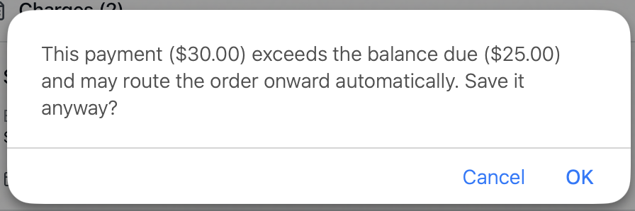 The confirmation prompt shown when a payment exceeds the balance due, warning that it may route the order onward automatically
