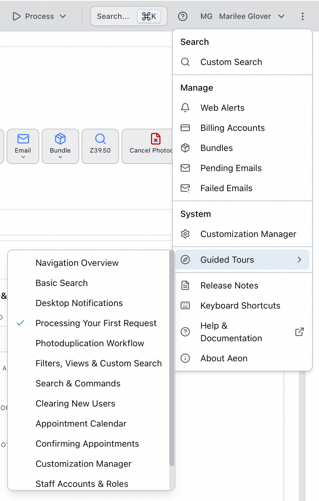 The more menu open with Guided Tours highlighted under System, its submenu listing the available tours with a green check beside a completed one, and the question-mark help button in the top navigation bar
