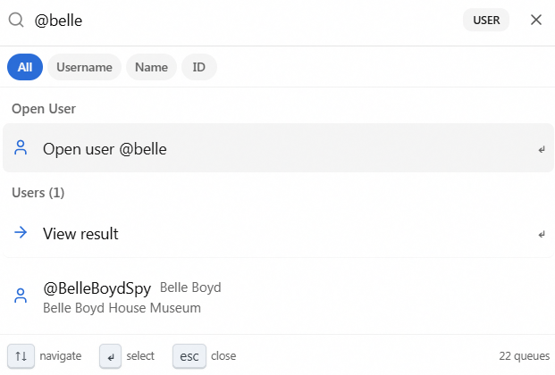 The command palette in user-search mode after typing @belle, showing the USER mode badge at the right of the input alongside matching user results.