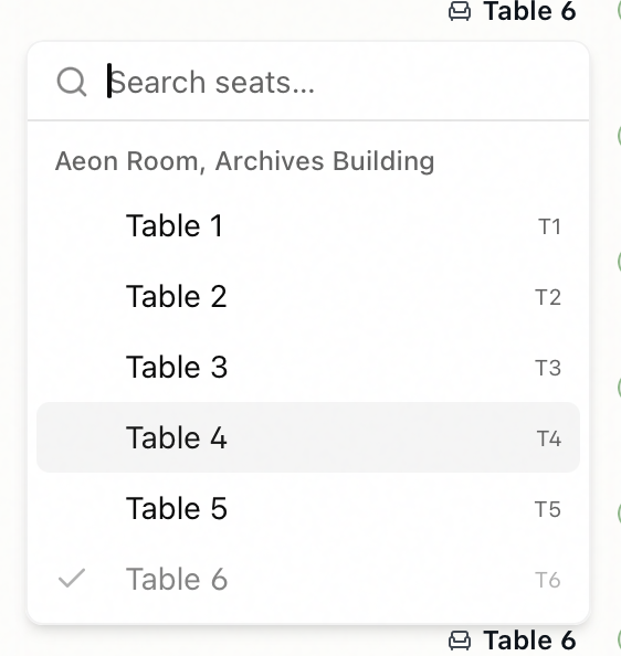 The seat picker popover open, showing the Search seats field and the reading room's list of seats with the current seat checked