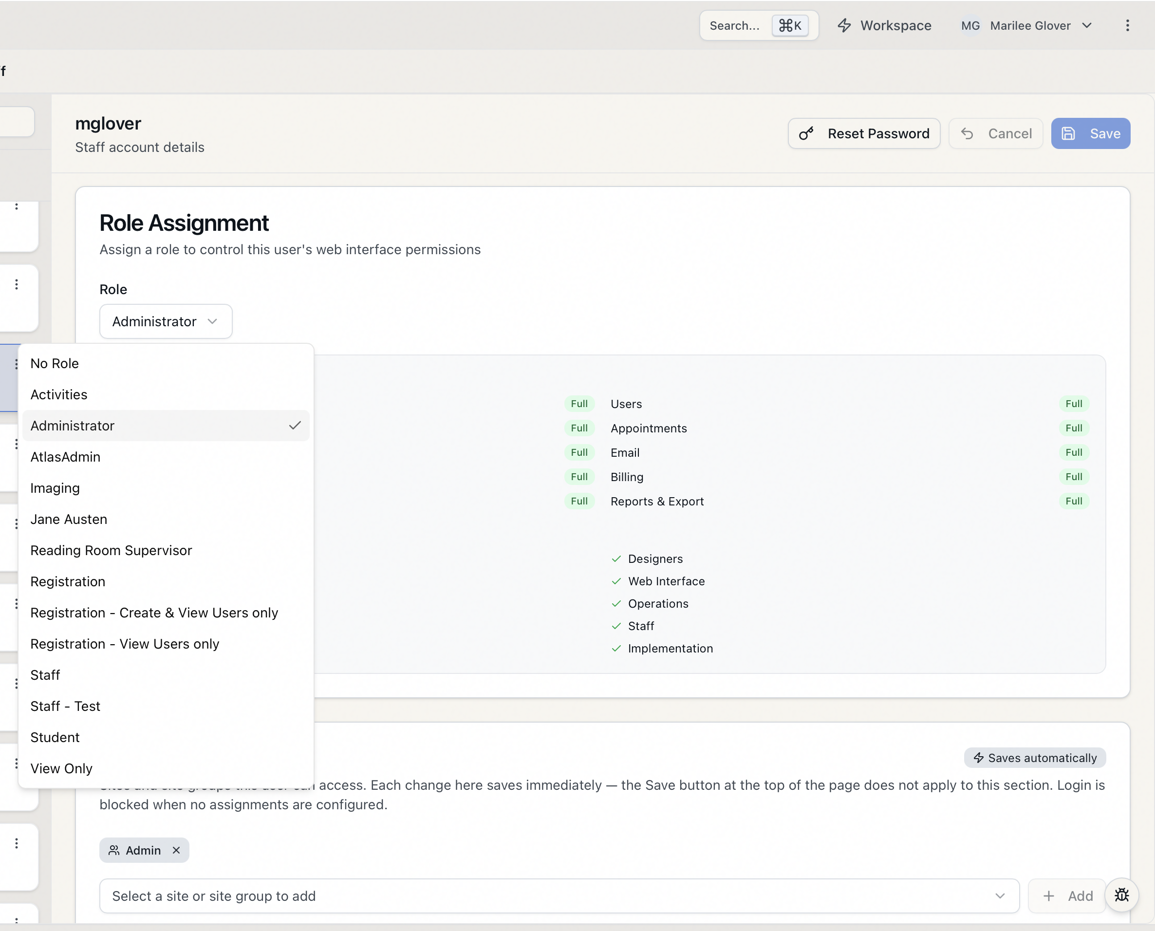 The Role Assignment card on a staff member's detail page with the Role dropdown open, listing the available roles