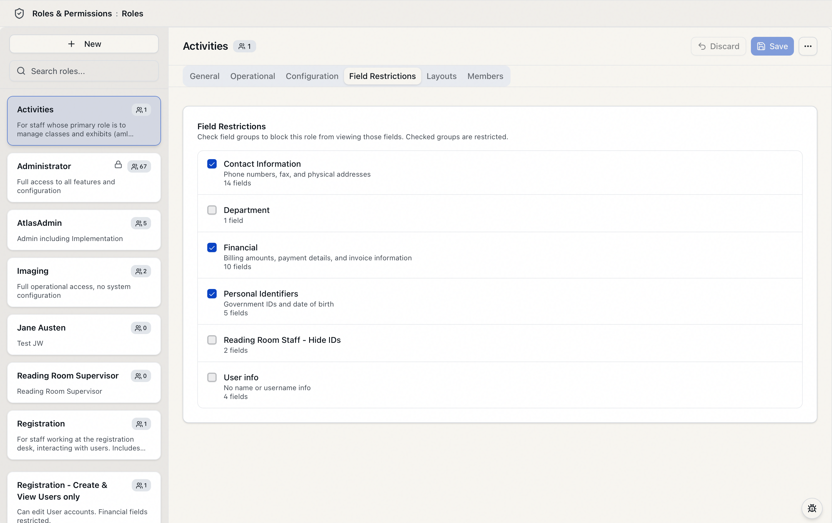 The role editor's Field Restrictions tab showing the field groups available to restrict, including the three system-default groups