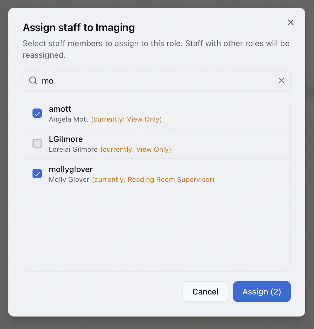 The Assign staff dialog with a search box, checkboxes to select multiple staff, amber currently-assigned-role notes, and an Assign count button