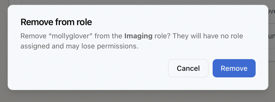 The Remove from role confirmation dialog warning that the staff member will have no role assigned and may lose permissions